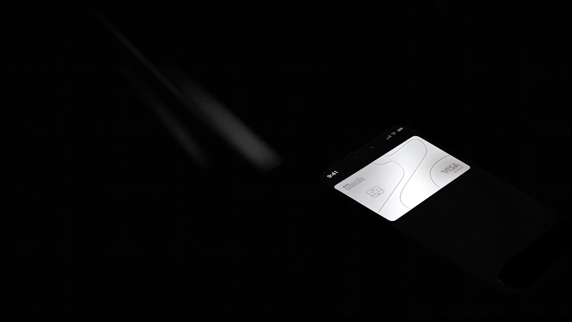 Slash Visa Business card on a phone resting on a concrete plinth